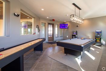 game room at mela's luxury apartments in san antonio